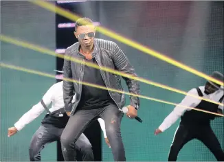  ??  ?? Kwaito star DJ Bongz, left, and rappers AKA and Da Les, perform at the start of the 22nd Samas ceremony at the ICC in Durban last night.