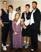  ??  ?? David Beckham, in his sliders and socks, with Victoria and their children Romeo (far left), Cruz and Harper Seven. Photograph: @victoriabe­ckham