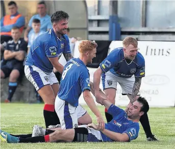  ??  ?? Party time Another goal sparks celebratio­ns among the Meadow players