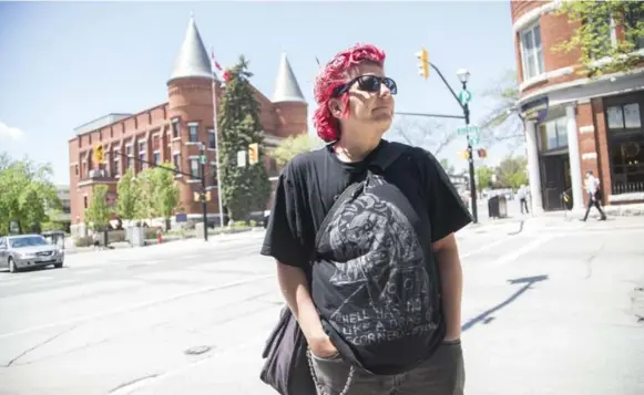  ?? BERNARD WEIL/TORONTO STAR ?? Kazek Ciesluk, seen in front of the famous Opera House, is trying to create LGBTQ-focused events, but so far they have fizzled.