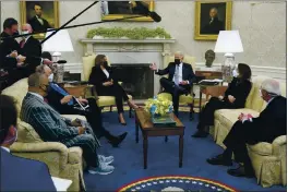  ?? PATRICK SEMANSKY — THE ASSOCIATED PRESS ?? President Joe Biden and Vice President Kamala Harris meet with lawmakers to discuss the American Jobs Plan in the Oval Office of the White House, Monday in Washington.