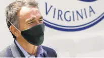  ?? STEVE HELBER/ASSOCIATED PRESS ?? Gov. Ralph Northam wears a face mask as he prepares to speak to volunteers in Richmond last week.