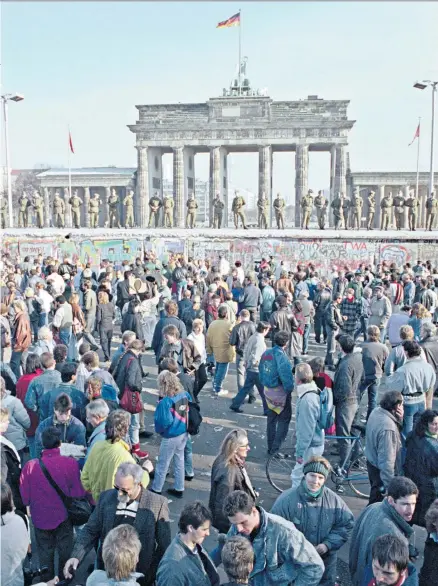  ?? ?? Triumph of liberalism? East Germans gather at Brandenbur­g Gate before the fall of the Berlin Wall in 1989
Enemy of ‘extremes’: Francis Fukuyama
To order any of these books from the Telegraph, visit books. telegraph. co.uk or call 0844 871 1514