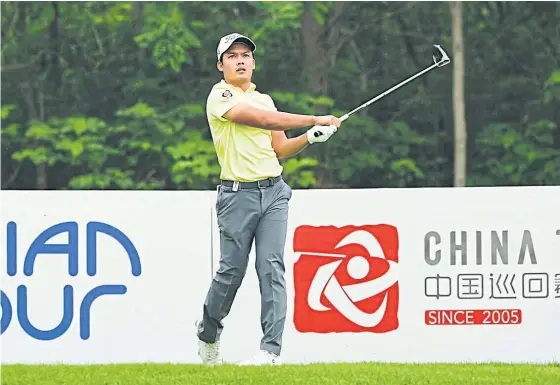  ??  ?? Natipong Srithong of Thailand drives during the second round of the Asia-Pacific Classic.