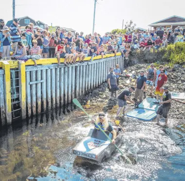  ??  ?? The almost-famous cardboard boat race is a big part of Champney’s West Days in Trinity Bay, Newfoundla­nd and Labrador.