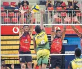  ?? Picture: ELIKI NUKUTABU ?? Mid Central players, from left, Bernard Vukivuki, Inia Delai and Seru Seniloli block out a Kinoya spike.