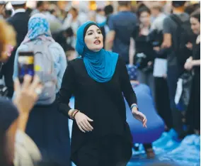  ?? (Lucas Jackson/Reuters) ?? LINDA SARSOUR prepares to demonstrat­e outside Trump Tower in Manhattan on Thursday.