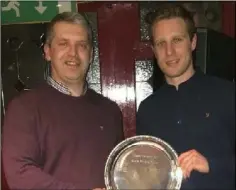  ??  ?? The Kevin Mullen Plate is presented to John Mitchel’s captain Emmett Farrell by County Board chairperso­n Des Halpenny.