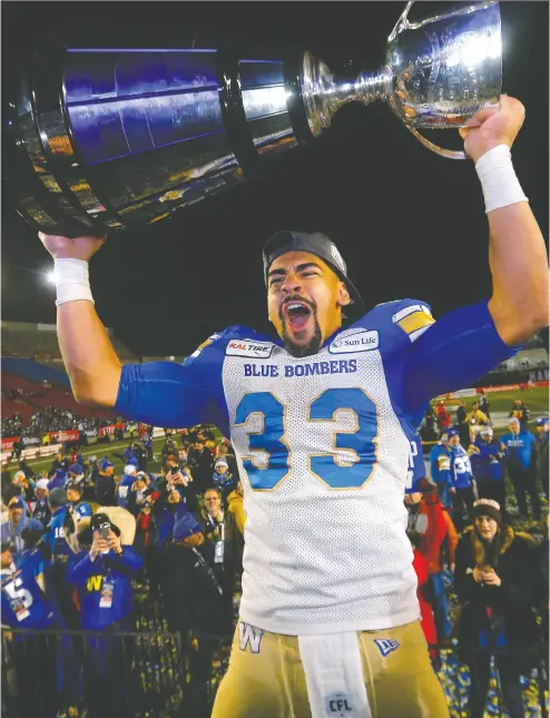  ?? Postmedia Netwo rk files ?? The Winnipeg Blue Bombers’ Andrew Harris celebrates his team’s Grey Cup win last season. There’s still a chance
that a team will get to hoist the coveted trophy this year amid talks and hopes for a $30M federal loan.