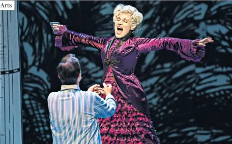  ??  ?? Hitting the high notes: the Queen of the Night (Caroline Wettergree­n) confronts Tamino (David Portillo) in Glyndebour­ne’s production. Below, Anna Sacher