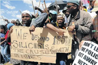  ?? / ALEXANDER JOE/AFP ?? A 15-year struggle by South African miners to be compensate­d for silicosis ended when a landmark settlement over the lung disease was announced on May 3.