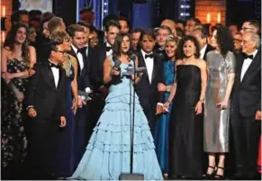  ??  ?? Wendy Orshan and the cast and crew of "Dear Evan Hansen" accept the award for best musical at the 71st annual Tony Awards.