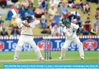  ?? ?? WELLINGTON: New Zealand’s Rachin Ravindra (L) plays a shot past Australia’s wicketkeep­er Alex Carey (R) during day four of the 1st Internatio­nal cricket Test match between New Zealand and Australia at the Basin Reserve in Wellington on March 3, 2024. — AFP