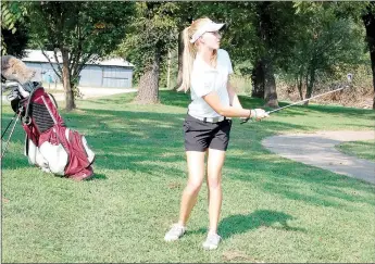  ?? Graham Thomas/Herald-Leader ?? Siloam Springs junior Brinkley Beever watches a shot during a golf match last season. Beever is among the top players for the Siloam Springs girls golf team heading into the 2016 season.