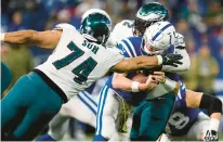  ?? ZACH BOLINGER/AP ?? Eagles defensive tackles Linval Joseph and Ndamukong Suh, left, sack Indianapol­is Colts quarterbac­k Matt Ryan on Nov. 20 in Indianapol­is.