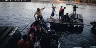  ??  ?? PEOPLE belonging to a caravan of migrants from Honduras en route to the US cross the Suchiate River to Mexico from Tecun Uman, Guatemala, yesterday. | JOSE CABEZAS Reuters