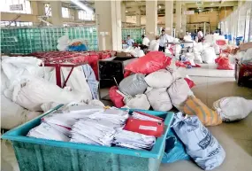  ??  ?? Mail bags pile up at the Colombo General Post Office