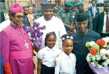  ??  ?? Acting President Prof. Yemi Osinbajo (right); Governor Ifeanyi Ugwuanyi of Enugu State (middle); Archbishop of Enugu Ecclesiast­ical Province (Anglican Communion), Dr. Emmanuel Chukwuma (left) and the bouquet bearers, during the 30th National Biennial Conference of the Students Christian Movement (SCM) of Nigeria, in Enugu, yesterday.