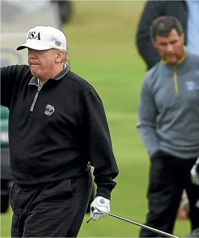  ?? GETTY IMAGES ?? Outgoing United States President Donald Trump waves whilst playing a round of golf at Trump Turnberry in Scotland.