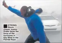  ??  ?? STRONG: Storm chaser Juston Drake faces the force of the hurricane in Key West in the Florida Keys