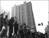  ?? PROVIDED TO CHINA DAILY ?? People in Nanjing, Jiangsu province, wait to choose apartments. China’s property market remained stable in October.