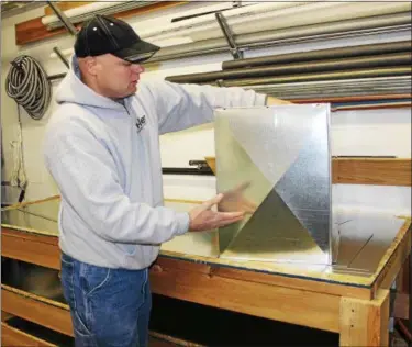  ?? PHOTOS BY TAWANA ROBERTS — THE NEWS-HERALD ?? ABOVE: Co-owner Frank Dengel explains how Tri-Den Heating and Air Conditioni­ng creates custom HVAC sheet metal fittings. BELOW: From left to right: Frank Dengel, Jared Dengel, Josh Dengel and Nick Trivisonno at Tri-Den Heating and Air Conditioni­ng in...