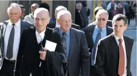  ?? Photo: David Forbes ?? Adriaan Vlok, two of his co-accused and his legal team outside the North Gauteng High
Court during the trial in 2007. On the far right is lawyer Jan Wagener, who has represente­d many of those accused of apartheid crimes, both from the military and the police