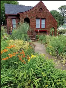  ?? COURTESY PHOTO ?? Deb King’s and Jeanne Sievert’s Bees Here Now Garden, 228 E. Dickson St., is intended to attract pollinator­s and honey makers — along with the occasional admiration of human passersby.