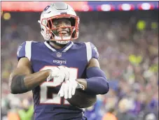  ?? Steven Senne / Associated Press ?? Patriots defensive back Duron Harmon celebrates his intercepti­on in the end zone against the Vikings on Sunday.