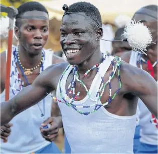  ?? AP PHOTO ?? Former child soldiers of the Lord’s Resistance Army (LRA) and community members make a traditiona­l Acholi dance performanc­e at a music therapy pilot program in Gulu, Uganda.