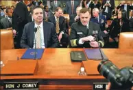  ?? JOSHUA ROBERTS / REUTERS ?? FBI Director James Comey and National Security Agency Director Mike Rogers at Monday’s hearing in Washington.