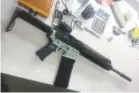  ?? Cody Wilson, via The Washington Post ?? The green lower receiver for this AR-15 was printed by Wilson in 2012.