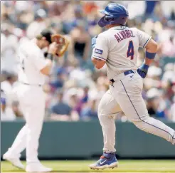  ?? Getty Images ?? FRANCISCO TREAT: Francisco Alvarez rounds the bases on his second three-run homer in as many days in the Mets’ 11-10 loss to the Rockies on Sunday.