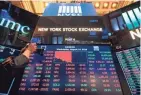 ?? JOHANNES EISELE/AFP/GETTY IMAGES ?? A board at the New York Stock Exchange reflects stocks’ tumble Wednesday.