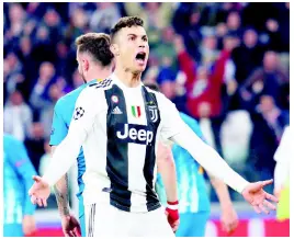  ?? AP PHOTOS ?? Juventus’ Cristiano Ronaldo celebrates after scoring the opening goal during the Champions League round-of-16 second-leg match between Juventus and Atlético Madrid at the Allianz stadium in Turin, Italy, yesterday.