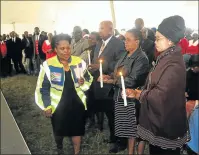  ?? Picture: SUPPLIED ?? SAD MOMENT: Transport, safety and liaison MEC Weziwe Tikana, left, attended a mass memorial service for five people, among them two fathers and their sons, who were killed when a car they were travelling in overturned between Cala and Lady Frere on...