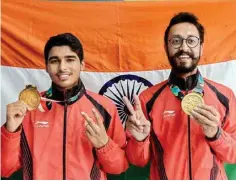  ??  ?? Gold medal winner Saurav Chaudhary and bronze medallist Abhishek Verma (right) pose during the medal presentati­on ceremony of men’s 10m air pistol event at Palembang on Tuesday PTI