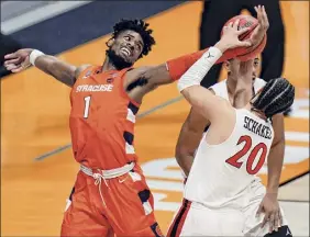  ?? AJ Mast / Associated Press ?? Syracuse forward Quincy Guerrier fights for a rebound with San Diego State guard Jordan Schakel in a first-round game.