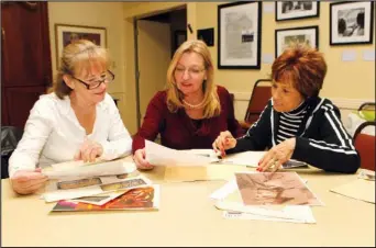  ?? The Sentinel- Record/ Richard Rasmussen ?? GIVING BACK: Diana Hampo, center, talks with Congregati­on House of Israel Board President Mary Klompus, left, and board member Sue Koppel on Thursday about the design documents her father created when working on the congregati­on’s current building.