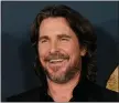  ?? CHRIS PIZZELLO, FILE - AP ?? Christian Bale and cast members in “The Pale Blue Eye,” share a laugh at the premiere of the film, Dec.
14, 2022, at the Directors Guild of America in Los Angeles.