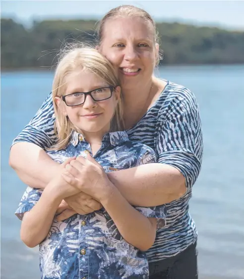  ?? Picture: CHRISTOPHE­R CHAN. ?? CLOSE CALL: Christina Fox with her son Patrick, 10, who almost drowned on Christmas Day last year.