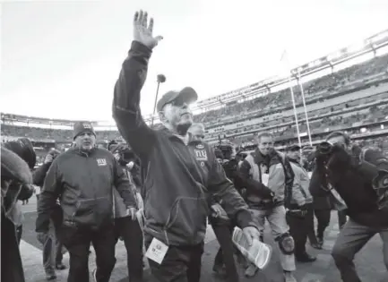  ??  ?? Two-time Super Bowl champion coach Tom Coughlin, 69, said farewell to Giants fans Sunday at the Meadowland­s and to Giants ownership Monday, resigning with a 110-93 record in 12 seasons with the team. Julio Cortez, The Associated Press