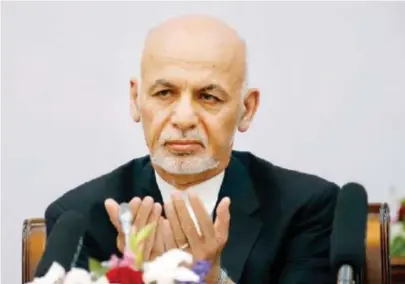  ??  ?? In this June 6 file photo Afghan President Ashraf Ghani prays during a peace and security cooperatio­n conference in Kabul. (File/Reuters)