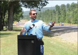  ?? The Sentinel-Record/Richard Rasmussen ?? PROJECT COMPLETE: Arkansas Department of Transporta­tion Director Scott Bennett speaks at a ceremony marking the completion of the Highway 70 east widening project from Hot Springs to I-30 Friday. The project was completed about three months ahead of...