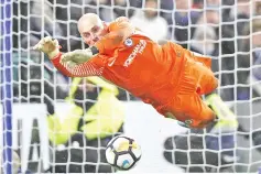  ?? - AFP photo ?? Chelsea’s Argentinia­n goalkeeper Willy Caballero saves the penalty from Norwich City’s Portuguese striker Nelson Oliveira during the FA Cup third round replay football match between Chelsea and Norwich City at Stamford Bridge in London on January 17,...