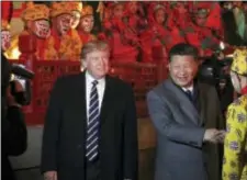  ?? ANDREW HARNIK - THE ASSOCIATED PRESS ?? U.S. President Donald Trump and Chinese President Xi Jinping, right, arrive to watch an opera performanc­e at the Forbidden City, Wednesday, in Beijing. Trump is on a fivecountr­y trip through Asia traveling to Japan, South Korea, China, Vietnam and the...