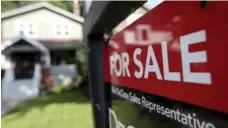  ?? RICHARD LAUTENS/TORONTO STAR FILE PHOTO ?? With the July drop to $773,000 as the benchmark Toronto property price, prices have tumbled back to what they were in March, David Olive writes.