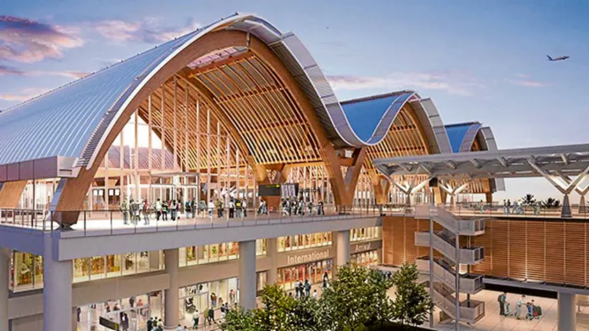  ?? —PHOTOS FROM DEZEEN ARCHITECTU­RE WEBSITE ?? caption
The most recognizab­le element of the new airport is the undulating roof that suggests ocean waves. A two-level forecourt separates the departure and arrival areas.