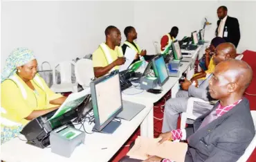  ?? Photo: NAN ?? Officials of the National Pension Commission enroll retires under the 2019 protective Federal Government lists from Niger State and FCT, in Abuja recently