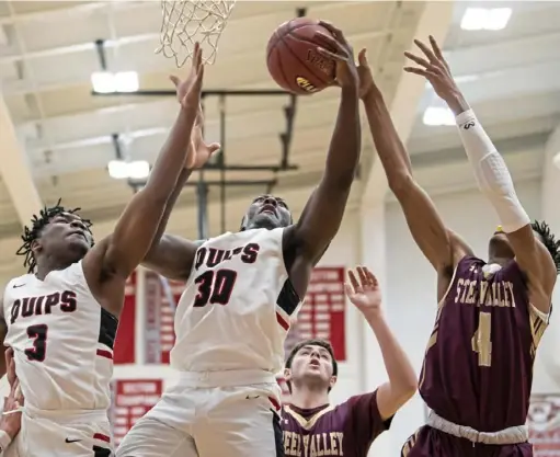  ?? Steph Chambers/Post-Gazette ?? Aliquippa’s Zuriah Fisher snatches a rebound away from Steel Valley in the first round of the WPIAL basketball playoffs Friday night at West Allegheny High School.